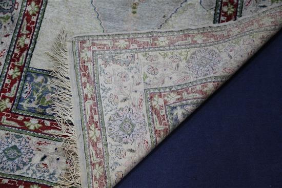 A Panderma part silk pale green/grey ground prayer rug, 5ft 4in by 3ft 6in.